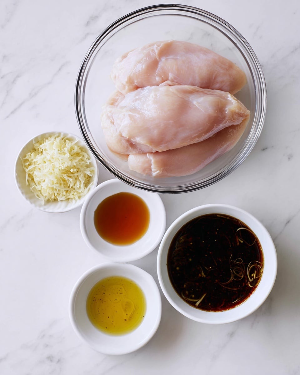 A large clear glass bowl holds two raw chicken breasts that are pale pink with smooth, moist skin, placed side by side. Around this bowl are four small white bowls: one has grated light beige ginger and shredded pale yellow garlic; another has a clear amber liquid, likely honey or oil; the third holds a thick black sauce with a glossy surface, and the last contains a dark brown marinade with visible thin slices of onions or herbs floating in it. All bowls sit on a white marbled surface. photo taken with an iphone --ar 4:5 --v 7