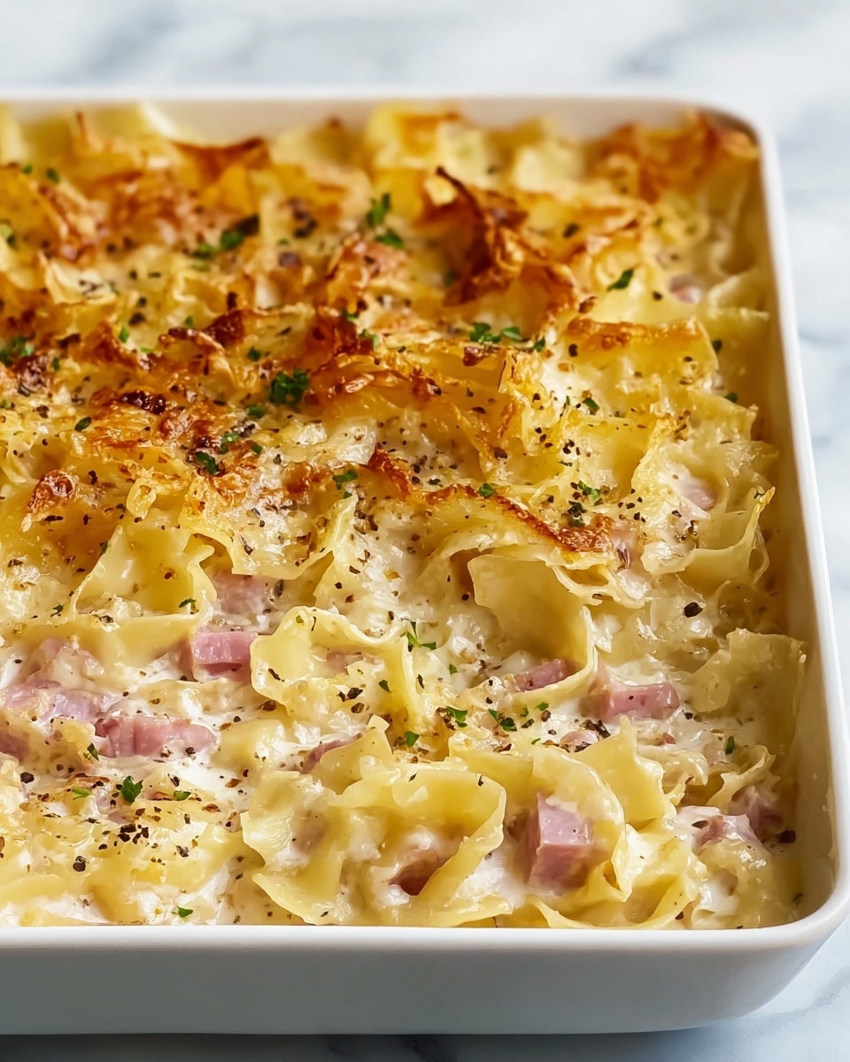 A close-up of a rectangular meatloaf with a golden-brown, slightly crispy top layer seasoned with herbs and small green parsley pieces sprinkled over it. The texture looks moist with visible bits of finely chopped vegetables mixed inside the light brown meat. The meatloaf rests on a white marbled surface. Photo taken with an iphone --ar 4:5 --v 7